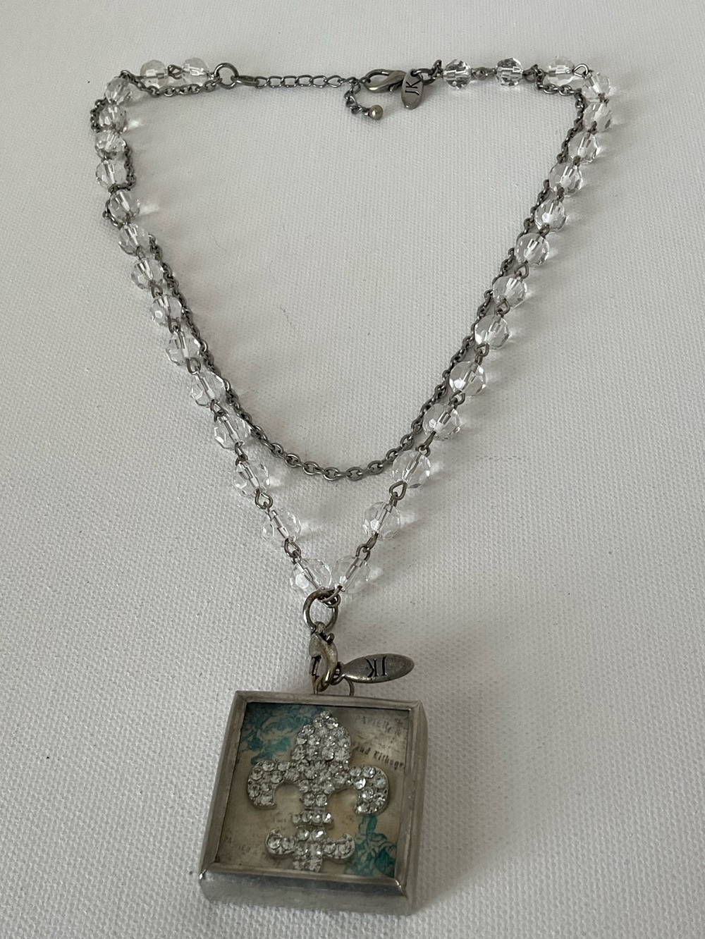 Jewel Kade Silver-Tone Crystal Fleur-de-Lis Motif  Locket with Clear Beads